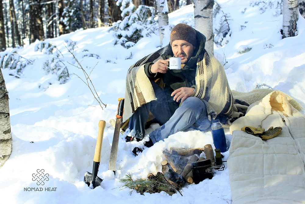 Philip Lhamsuren wrapped in a wool Nomad Heat blanket